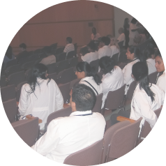 Students attending Grand Round lecture inside the Hospital